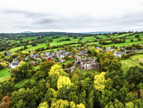 Autumn Colours over ruins of Grosmont Castle from a drone, Grosmont, Monmouthshire, Wales, UK