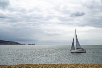 Yacht over Hurst Spit, Milford on Sea, Lymington, Hampshire, UK
