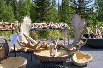 Sales stand for souvenirs with elk antlers and wood carving, Alaska, USA