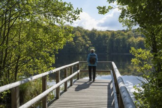 Woman on the viewing platform, Schwarzer See, Granitz Nature Reserve, Southeast Rügen Biosphere