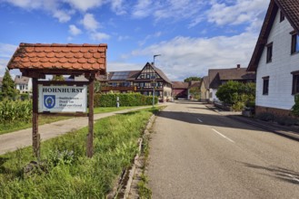 Tourist sign Hohnhurst - southernmost village in Hanauerland, houses, general development, road,