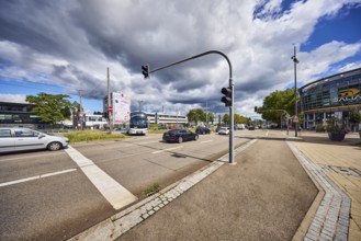 Traffic light crossing, general architecture, train station, sidewalk, cycle path, road, cars,