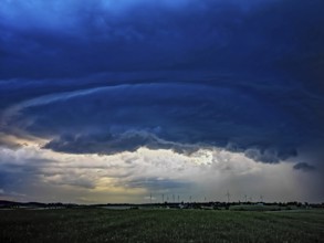Supercell, approaching thunderstorm with impressive and threatening cloud formation of a