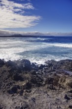 Rocky coast with big waves and wide horizons under clear skies, Playa del Janubio, Yaiza Lanzarote