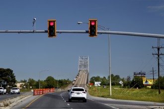 A bridge across a road with traffic lights and passing cars in the Mississippi Valley, Mississippi
