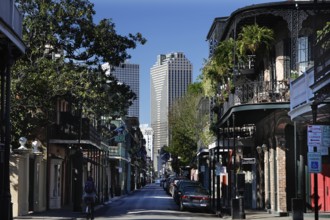 Charming street in the French Quarter with skyscraper in the background, New Orleans, Louisiana,