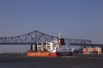 View of bridge and cargo ship in New Orleans Harbor, New Orleans, null, USA