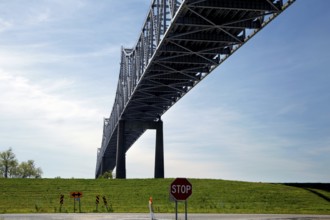 Large steel bridge over a green landscape with stop sign, Mississippi Valley, USA