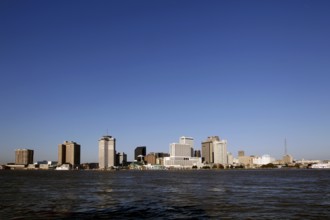 Wide view of New Orleans skyline with clear sky from afar, New Orleans, Louisiana, USA