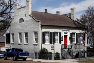 Historic house with red door in urban area, Natchez, USA