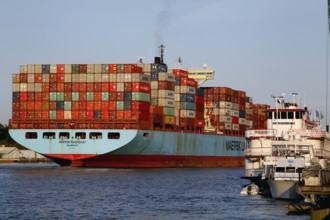 Large container ship on Savannah River, busy harbor area, Savannah, Georgia, USA