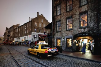 Evening scene on Savannah Riverfront with taxi and beautiful lights, Savannah, Georgia, USA