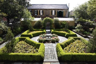 Well-maintained historic garden with symmetrical layout and a fountain, Savannah, Georgia, USA
