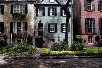 Small historic town house with colorful facades and well-kept front garden, Savannah, Georgia, USA