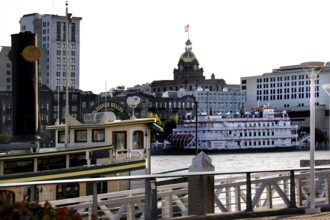 Historic ships on Savannah River flanked by impressive architecture, Savannah, Georgia, USA