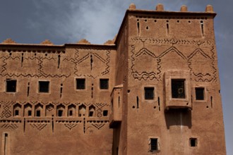 Detailed façade of Kasbah Taourirt with ornate patterns and traditional design, Ouarzazate,