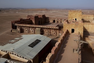 Panoramic view of a fortified complex in the desert, film set with extensive layout, Ouarzazate,