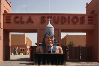 Entrance to CLAS Studios with large pharaoh statue in Egyptian style, Ouarzazate, Morocco