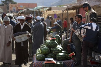 Vendors sell watermelons at a market in Msemrir, Msemrir, Morocco