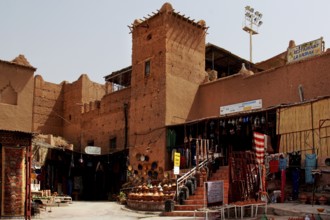 Traditional kasbah with souk, where sand-colored facades dominate the picture, Ouarzazate, Morocco
