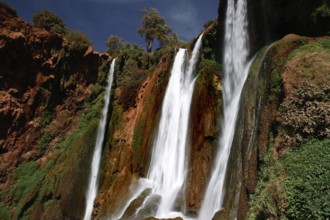 Majestic waterfalls of Ouzoud with thundering water surrounded by rocks and greenery, Ouzoud,