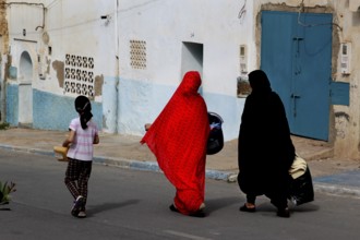 Two woman wearing traditional clothes in the old town of Sidi Ifni, Sidi Ifni, Souss-Massa, Morocco