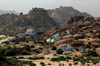 View of painted rocks by Jean Verame in the mountainous landscape of Tafraoute, Tafraoute,