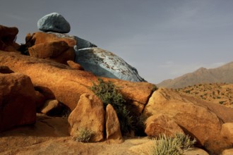 Blue and red rocks by Jean Verame in the desert landscape of Tafraoute, Tafraoute, Souss-Massa,