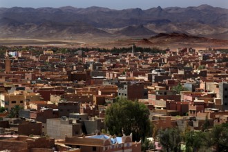 Overview of the city of Tinerhir with roofs and mountains behind them, Tinerhir, Morocco