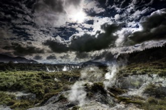 Impressive Waiotapu geothermal area with rising steam and dramatic clouds, Waiotapu, Bay of Plenty,