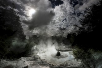 Steaming geothermal area near Waiotapu with active mud springs and dramatic skies, Waiotapu, Bay of