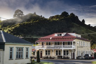 A historic hotel in Whangamomona with surrounding mountains in the background, Whangamomona, New