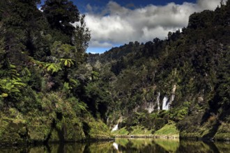 Lush green landscape with waterfall along Whanganui River, Whanganui River, New Zealand