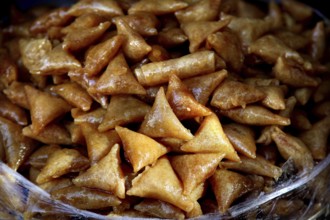 Traditional Moroccan sweets in golden brown color in close-up, Fez, Fez el Bali, Morocco