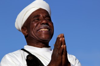 A man smiles happily at the traditional Berber festival, Ma El Kelâa m'Gouna, Fête des Roses,