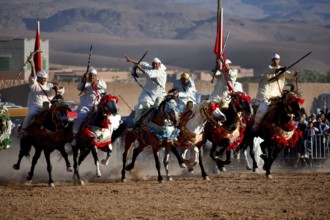 Committed riders cheer about the remarkable collaboration at the traditional Fantasia equestrian