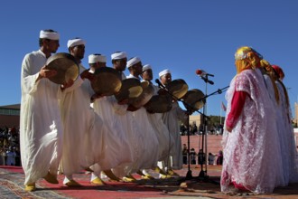 Berber dancers in traditional white clothes dance at the Festival of Roses, Ma El Kelâa m'Gouna,