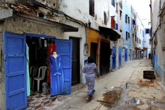 Lively alley with typical blue doors in Moroccan old town, Essaouira, Marrakesh-Safi, Morocco