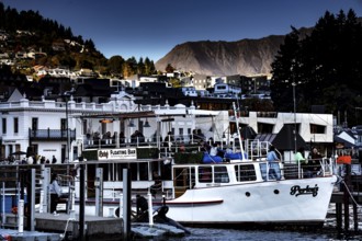 Queenstown harbour with boats and city in the background, Queenstown, New Zealand