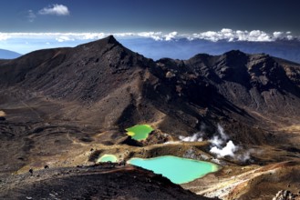 Brilliant green Emerald Lakes amidst steep volcanic landscape, Tongariro National Park, New Zealand