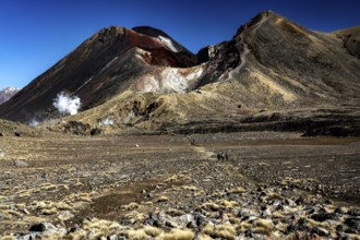 Rugged volcanic landscape of the Tongariro Alpine Crossing with two distinctive peaks, Tongariro
