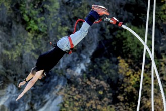 Person upside down in free fall from bungee jumping at Kawarau Bridge, Queenstown, Kawarau Bridge,