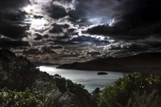 Dramatic clouds over a nighttime waterscape, Queen Charlotte Sound, Marlborough, New Zealand