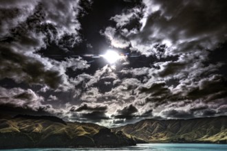 Moonlight breaks through dramatic clouds over Queen Charlotte Sound, Queen Charlotte Sound,
