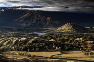 Breathtaking views from Coronet Peak with majestic mountains and dramatic clouds, Queenstown,