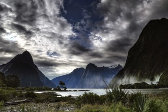 Impressive fjord with dramatic skies and majestic high mountains, Milford Sound, New Zealand