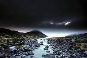 River course and rocky landscape under a dramatic sky in Hocker Valley, New Zealand, zero