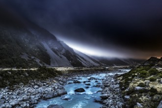 River and rocky landscape under an ominous sky in Hocker Valley, New Zealand, zero