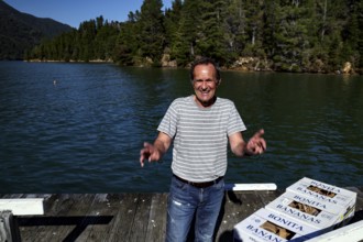 Happy man on a pier at Pelorus Mailrun delivering mail