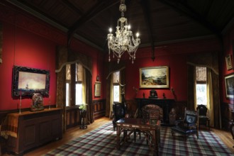 Sumptuous room in the castle with antique furniture and a large chandelier, Larnach Castle, Otago